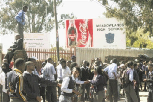 NO ORDER: Pupils say there is no teaching at the school and teachers sit in the staff room all day. The school's governing body locked the school gates last week. PHOTO: BAFANA MAHLANGU