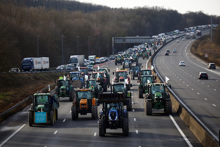 French farmers drive their tractors on a highway as they protest over price pressures, taxes and green regulation, grievances shared by farmers across Europe, in Longvilliers, near Paris on January 29 2024. Picture: REUTERS/Sarah Meyssonnier