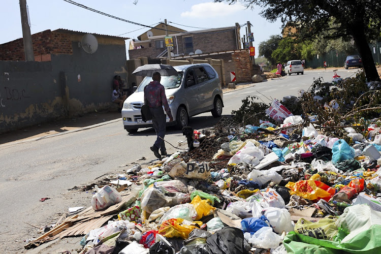 Alexandra residents are fed up with living between piles of rubbish.