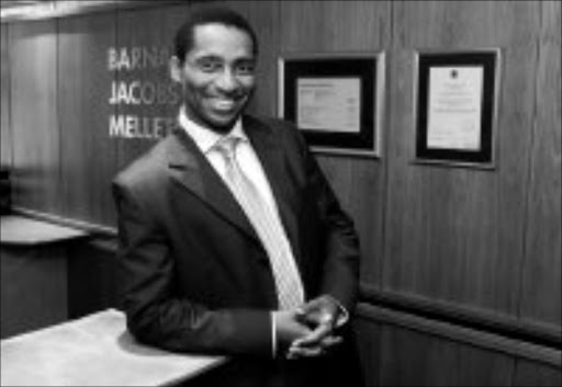 KNOWING NUMBERS: Barnard Jacobs Mellet Securities chief executive officer Andile Mazwai says stock broking has provided him with an opportunity to perfect his entrepreneurial skills. Pic. Russell Roberts. 15/05/06. © Financial Mail.
