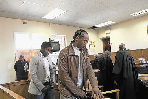 Hip-hop musician Molemo 'Jub Jub' Maarohanye, in brown jacket, and co-accused Themba Tshabalala during their trial in the Protea Magistrate's Court. File photo.