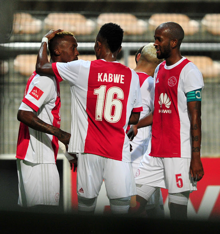 Ajax Cape Town striker (L) celebrates with teammates Roderick Kabwe and captain Mosa Lebusa (R) during the Absa Premiership match against Bidvest Wites at Athlone Stadium, Cape Town on 11 April 2018. Ajax won 1 - 0.