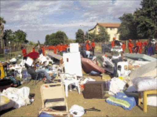 SURPRISE EVICTION: The Red Ants raided several flats in Mmabatho early yesterday morning and forcefully evicted tenats who have resisting eviction since last week. Pic. Elisha Molefe. 29/10/2008. © Sowetan