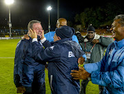 Bidvest Wits owner, Brian Joffe (R) celebrates with head coach Gavin Hunt, who just won the 2016/17 PSL champions, after the Absa Premiership match against Polokwane City at Bidvest Stadium on May 17, 2017 in Johannesburg, South Africa.