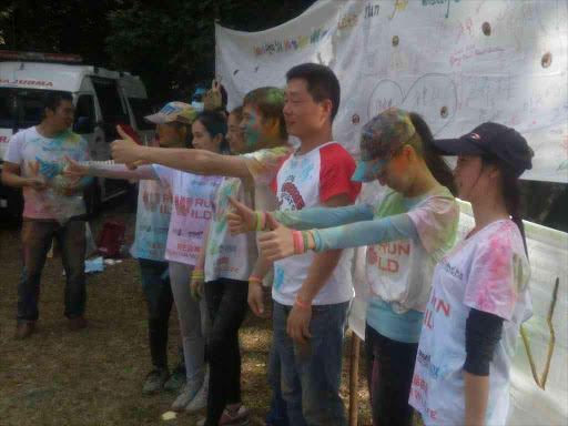 Participants at the inaugural Wildlife Conservation Colour Run after signing a board pledging to boycott the ivory trade at Ngong Forest,indicating support for the African Elephant Coalition package of CITES proposals when the convention meets September and October in South Africa.