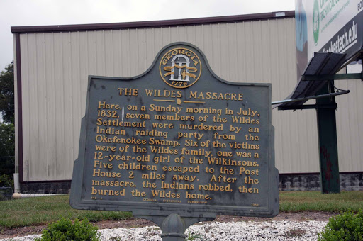 Here, on a Sunday morning in July, 1832, seven members of the Wildes Settlement were murdered by an Indian raiding party from the Okefenokee Swamp. Six of the victims were of the Wildes family,...