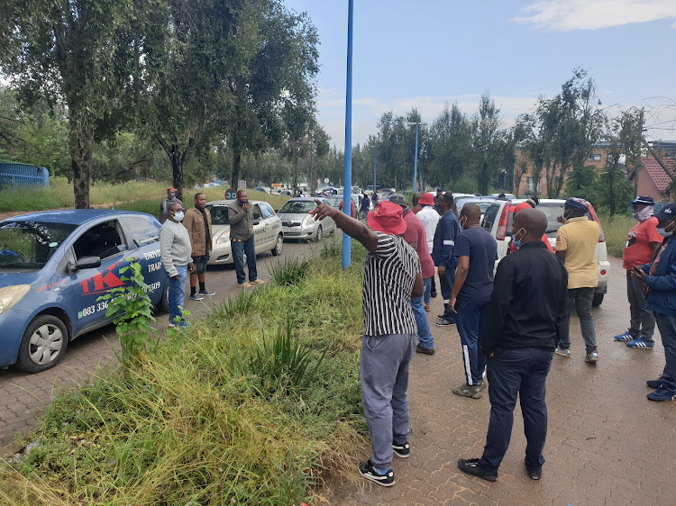 Protesters prevent the public from entering the Sandton DLTC on Friday morning.