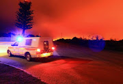 Wildfires burn near Plettenberg Ba.. Strong winds fanned fires destroyed houses and prompted the evacuation of thousands of residents in nearby Knysna.