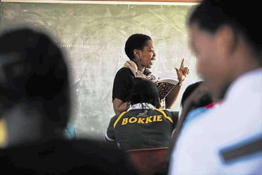 Plantina Nkuzana teaches English to a full classroom of matrics at Diepsloot Combined School, north of Johannesburg, at the weekend. Pupils from seven high schools in the area attended the Saturday lessons. File photo.