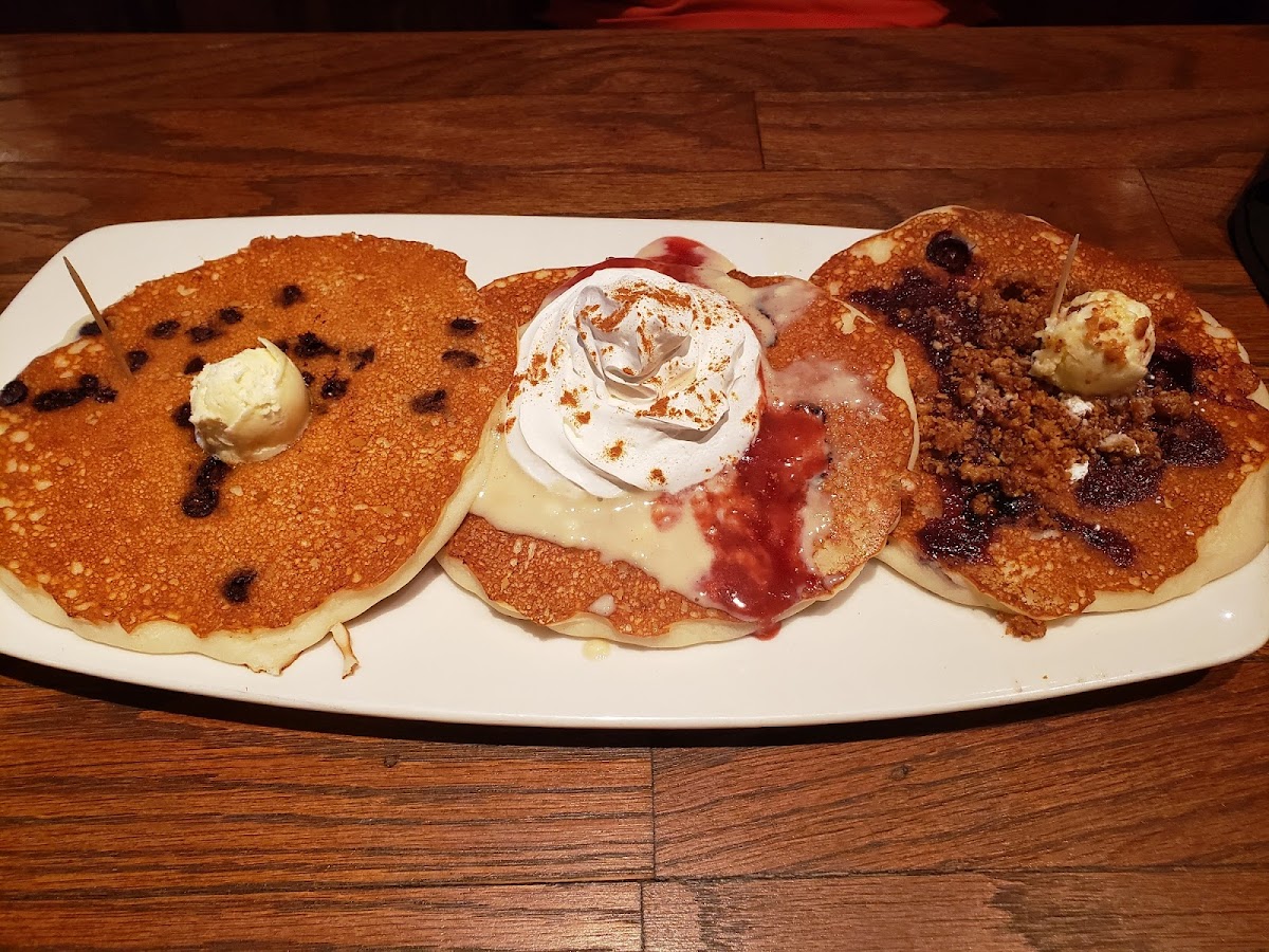 Gluten-free pancake flight. Chocolate chip, strawberry cheesecake and blueberry streusel. So delicious!!!