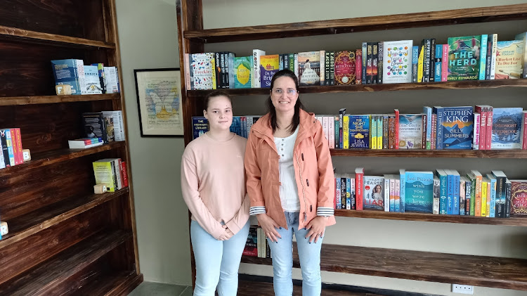 The Book Lounge owner Jessica Simons, right, said stage 6 load-shedding has been a serious obstacle for their new business. Standing with her is Jasmin Smith.