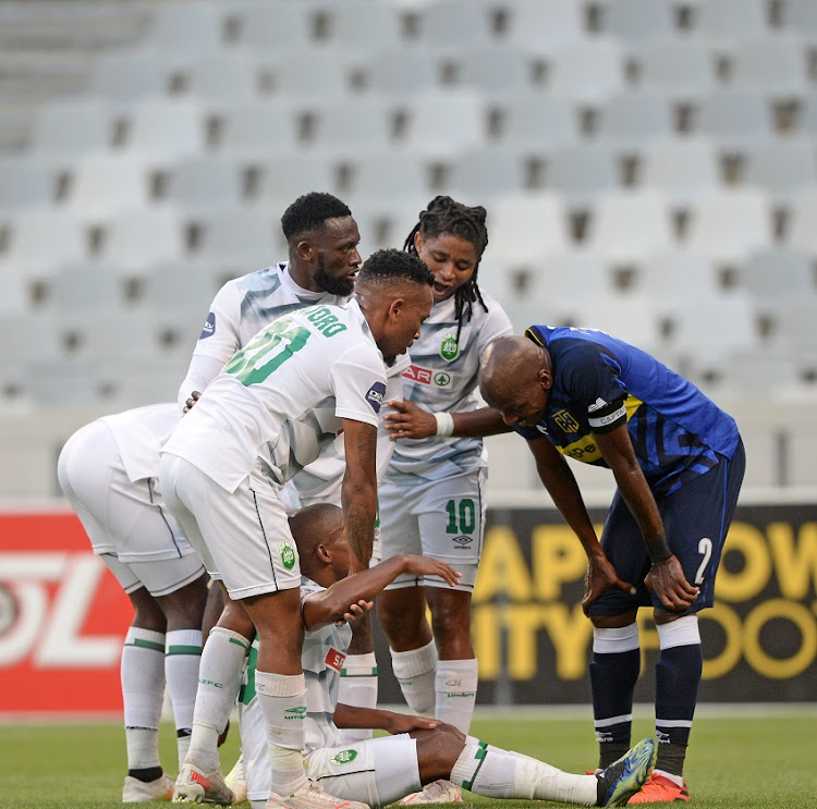 AmaZulu players gather around Luvuyo Memela of AmaZulu after he wins his team a penalty during the DStv Premiership match between Cape Town City FC and AmaZulu FC at Cape Town Stadium on April 29, 2021 in Cape Town, South Africa.