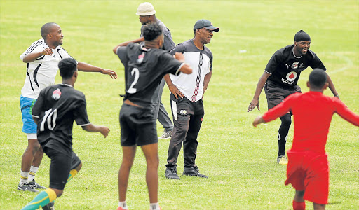 READY TO CAUSE UPSET: Tornado Football Club players with their coach, Jerry Sikhosana, ahead of their Nedbank Cup game against Orlando Pirates tomorrow Picture: MICHAEL PINYANA
