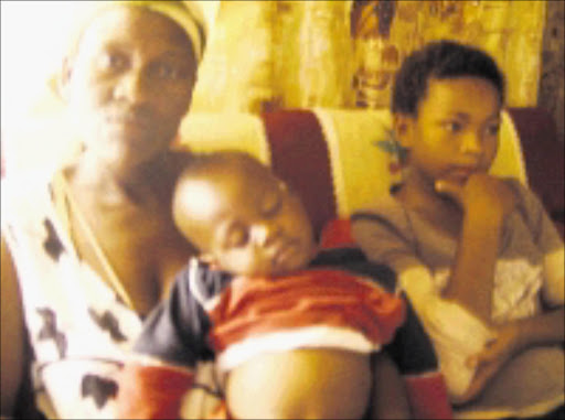 TOGETHER AGAIN: Nancy Sethosa with her son Delson and daughter lenda. Grace and Max also retuned home. Cicra 2008. Pic. Moyahabo Mabeba. © Sowetan.