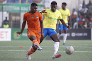 Mohamed Said of FC Nouadhibou is challenged by Teboho Mokoena of Mamelodi Sundowns in their Caf Champions League group match at Stade Cheikha Ould Boïdiya in Nouakchott, Mauritania on Saturday.