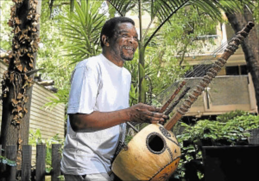 EXOTIC SOUND: Musician Pops Mohammed plays his kora instrument. Photo: Kevin Sutherland