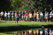 Justin Thomas of the United States skips a ball across the pond on the 16th hole during a practice round prior to the Masters at Augusta National Golf Club on April 06, 2021 in Augusta, Georgia. 