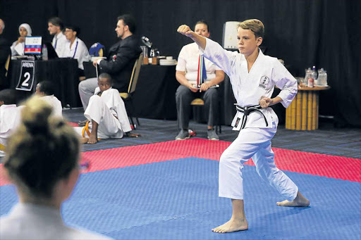 STYLISH STANCE: Jaco van der Merwe from Shotokan Circle of Karate club performs a kata during the UWK SA Karate Championships held at Fish River Sun over the weekend Picture: ALAN EASON