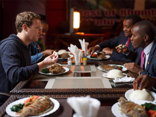 Facebook co-founder and CEO Mark Zuckerberg has lunch with ICT CS Joe Mucheru at Mama Oliech Restaurant in Yaya, Nairobi, during his visit to Kenya, September 1, 2016. /COURTESY