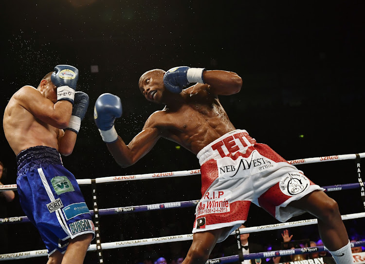 Zolani Tete (R) right hooks Omar Andres Narvaez during the WBO Bantamweight Championship of the World title fight at SSE Arena Belfast.