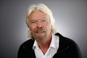 Richard Branson, chairman and founder of Virgin Group Ltd., poses for a photograph following a Bloomberg Television interview in Davos, Switzerland, on Thursday, Jan. 21, 2016. World leaders, influential executives, bankers and policy makers attend the 46th annual meeting of the World Economic Forum in Davos from Jan. 20 - 23.