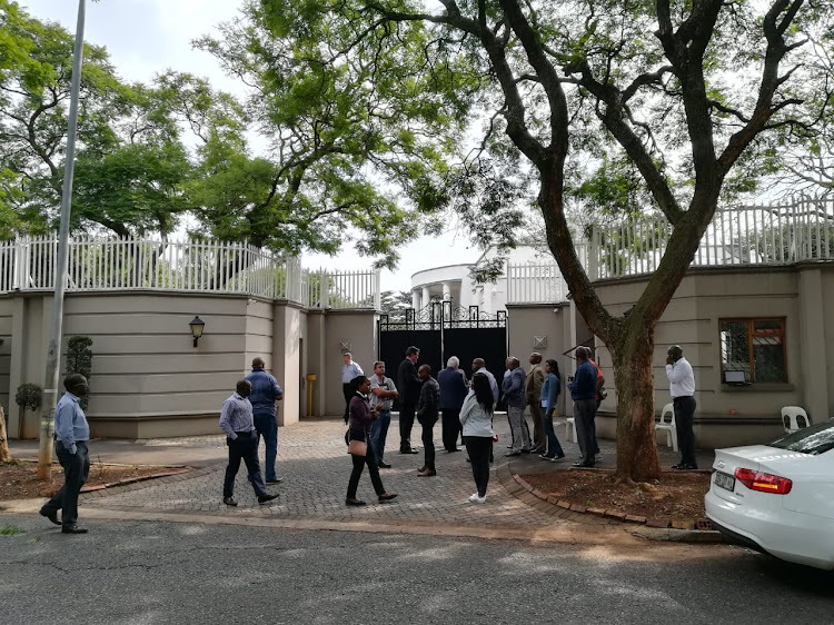 Officials from various government enforcement agencies descended on the Gupta compound in Johannesburg on Monday, apparently as part of asset seizure operations.