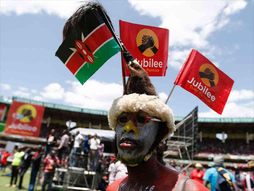 Supporter of Jubilee Party follow the proceedings during the launch of the Party at Safaricom Stadium in Nairobi on Septermber 10, 2016. Photo/Jack Owuor