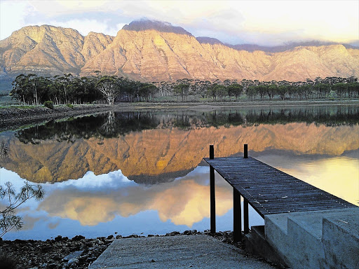DRIFT AWAY: The farm dam with the Elandskloof mountains beyond