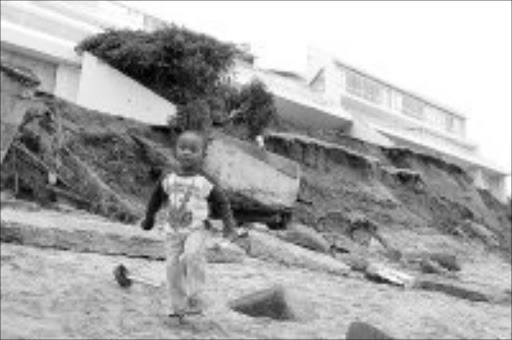 POUNDED: High seas caused huge damage along the coast. Pic. Mandla Mkhize. © Sowetan.