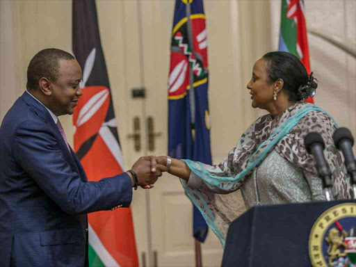 President Uhuru Kenyatta congratulates CS Amina Mohamed on her nomination for chairperson of the African Union Commission at State House on October 5 /FILE