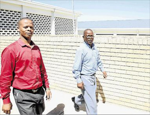 ACCUSED: Mdantsane ward 24 secretary Melisizwe Tutu, left, and branch chairman Sandla Sotaka appeared briefly in court Picture: SIBONGILE NGALWA