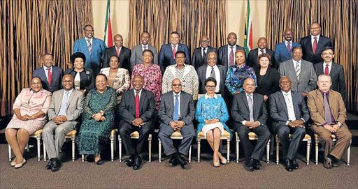 President Jacob Zuma with his ministers. The writer argues that to save costs, it would have to start with Zuma’s bloated cabinet.