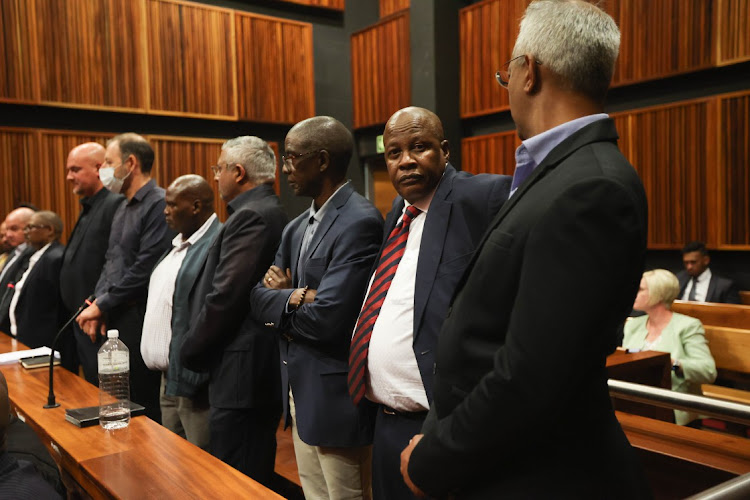 The accused In the Transnet fraud and corruption case in the dock on November 30 2022 in the Palm Ridge magistrate's court, south of Johannesburg. They include Anoj Singh (right) and Brian Molefe (second from right).
