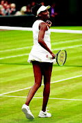 Venus Williams  celebrates  on Tuesday in London. /  Michael Steele / Getty Images