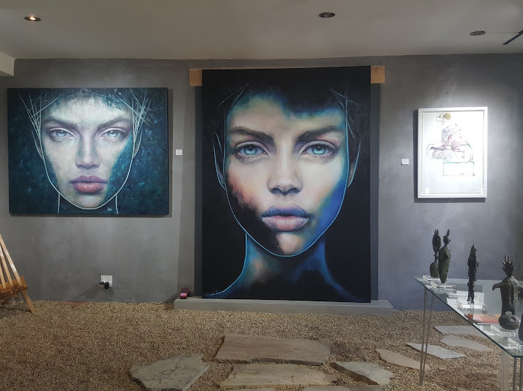 Gallop Hill interior showing the striking design and layout with a focus on on portraiture work by Phulani Liebenberg.