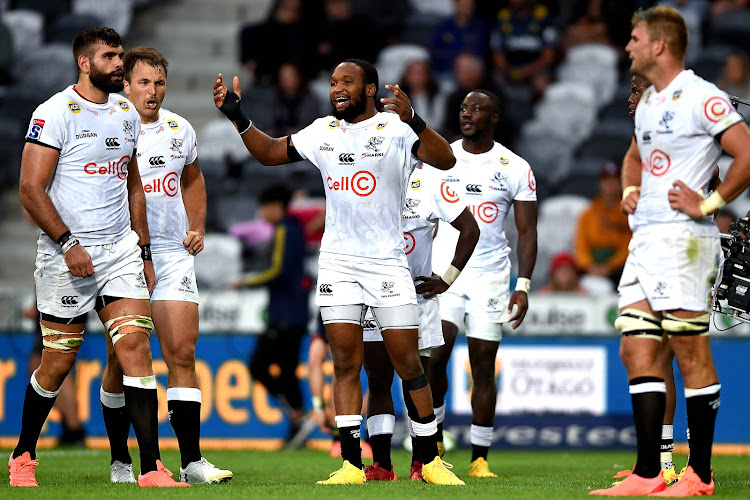 The Cell C Sharks captain Lukhanyo Am (C) leads his team's celebrations after winning against the Highlanders at the Forsyth Barr Stadium in Dunedin.