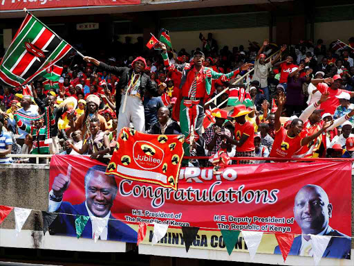 People celebrate as President Uhuru Kenyatta takes the oath of office during his swearing-in at Kasarani stadium in Nairobi, November 28, 2017. /REUTERS