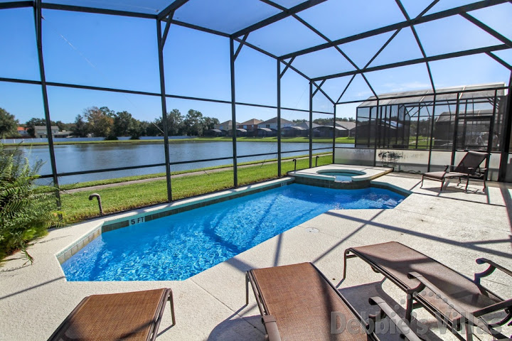 Stunning lake view from the pool and spa deck of this Kissimmee vacation villa