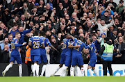 Carney Chukwuemeka celebrates scoring Chelsea's third goal with teammates in their FA Cup quarterfinal win against Leicester City at Stamford Bridge in London on Sunday.