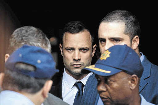 BAT OR BULLET? Oscar Pistorius arrives at the High Court in Pretoria for his trial this week Picture: DANIEL BORN