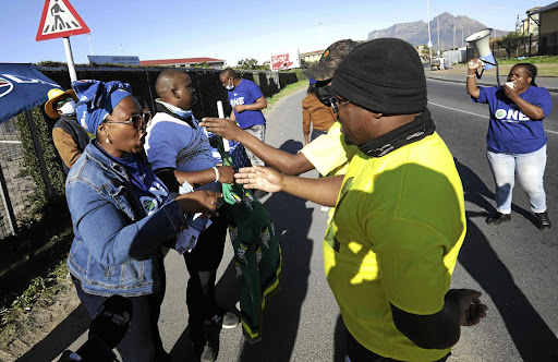 Election season: ANC and DA members campaign in Langa during voter registration weekend. Picture: Esa Alexander