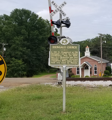 E. 150 ft. Organized at Old Shongalo, 1mi. W., by Clinton Presbytery, Aug. 29, 1835. Rev. A.C. Dickerson was first minister. Present structure completed 1875. Upper story built and used by Masons.
