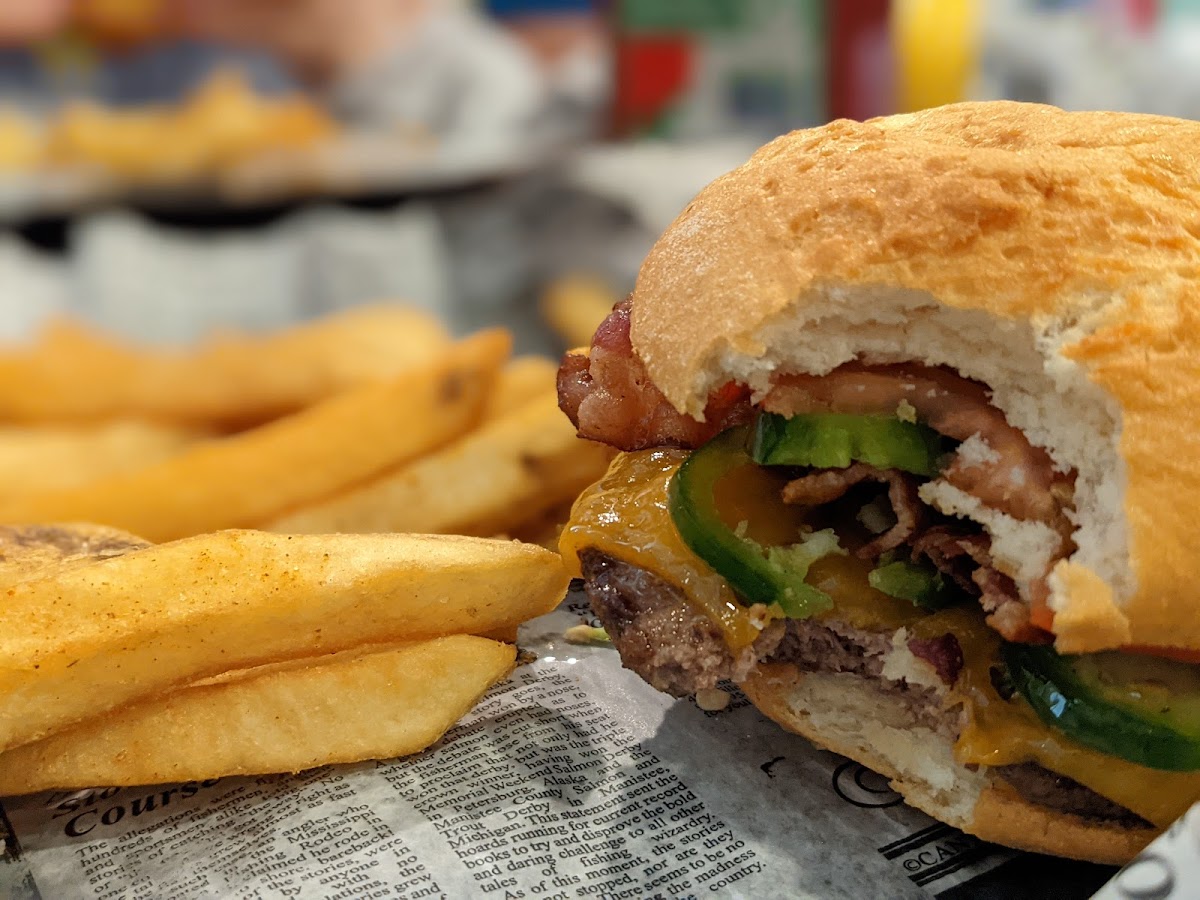 Burger with jalapenos, bacon and cheese.