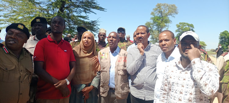 PS State Department for the ASALS and Regional Development Kello Harsama and other local leaders at the scene where the boat capsized at Kona Punda read along the Garissa- Madogo road.