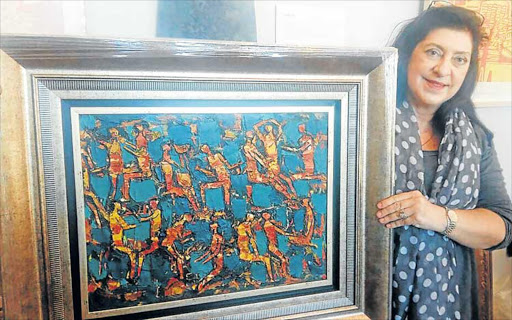HEFTY PRICE: Vincent Art Gallery owner Rene Goosen had her Walter Battiss masterpiece valued at between R300 000 and R500 000 at the Strauss & Co valuation roadshow at the Ann Bryant Art Gallery yesterday Picture: BARBARA HOLLANDS