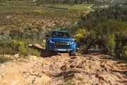 Flagship Isuzu towers over regular passenger cars.