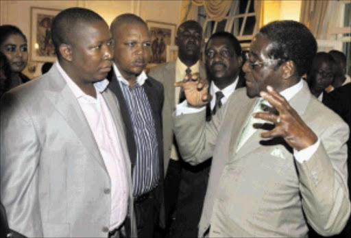 ADVICE: ANC Youth League leader Julius Malema is welcomed by Zimbabwean President Robert Mugabe at State House in Harare last year. Photo: Reuters/Philimon Bulawayo