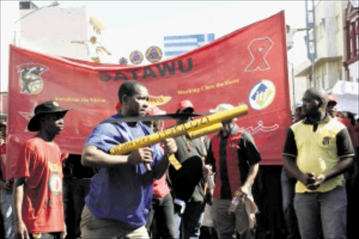 PORT PILE-UP: Striking members of Satawu marching in Durban as part of the Transnet strike. Pic. THULI DLAMINI. 24/05/2010. © Sowetan.