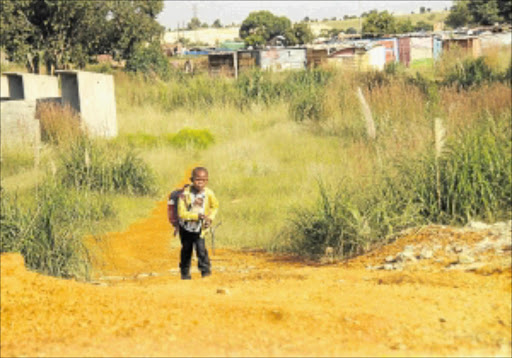 UNSAFE PATH: A child walks home from school.