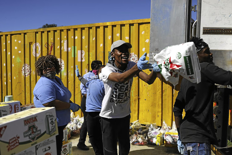 The African Children’s Feeding Scheme goes door to door to deliver food parcels to people in need in Tsakane, near Brakpan in Gauteng.